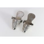 Two South American style, perhaps Peruvian? white metal models of stirrup shoes or slippers with