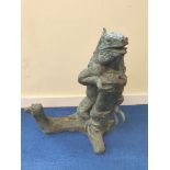 Large contemporary bronze garden water feature of an Iguana climbing a tree branch with deep surface