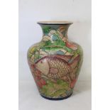 Large Art Pottery painted terracotta vase of baluster form decorated in polychrome with two relief