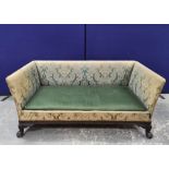 Regency style sofa, upholstered in a pale green floral damask, on carved mahogany hairy paw feet,
