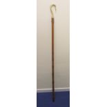 Michael Gibbon, 20th century carved wooden bishop's crook, 195cm long, signed with carved figure