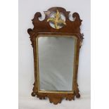 George III style wall mirror with fret cut walnut veneered frame, pierced foliate pediment and