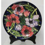 Modern Moorcroft Pottery "Anemone Tribute" pattern circular plate, designed by Emma Bossons,