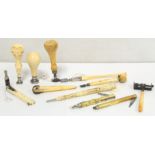 Collection of various ivory handled writing and other implements, including: pencils, one with