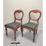 Six Victorian mahogany balloon back chairs with green upholstered slip in seats raised on turned