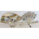 Two 19th century fans, the first with hand painted paper leaf depicting a lake scene on pierced