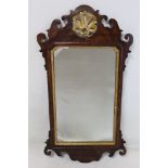 George III style mahogany veneered wall mirror, fret cut frame with pierced shell pediment and