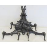 Late 19th/early 20th century Black Forest ebonised carved hat and coat rack, the central panel