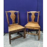 Set of eight Georgian oak country chairs, with fiddle shaped splat backs, on chamfered supports with