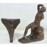 Antique carved wooden bracket or support of triangular form with figure of a putto, 17cm high,