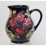 Modern Moorcroft Pottery "Anemone" pattern jug of baluster form, with impressed and painted marks,