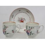 Two 18th century English porcelain coffee cups decorated with polychrome floral sprays and iron