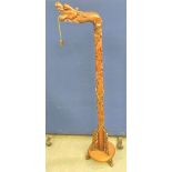 Early 20th century Chinese hardwood lamp stand in the form of a dragon. Raised on a turned carved