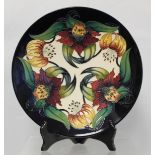 Modern Moorcroft Pottery "Anna Lily" pattern circular plate, designed by Nicola Slaney, impressed