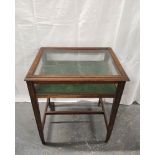 Mahogany bijouterie table with a glazed hinged top on tapered supports with understretcher. 69cm