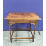 Early 18th century oak hall table in the Queen Anne style with frieze drawer raised on turned