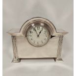 Edwardian e.p. mantel timepiece with lever platform in break arch case with spreading feet, 19cm.