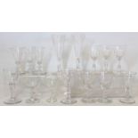 Collection of fifteen antique drinking glasses including: a pair of flutes with faceted trumpet