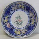 19th century Continental tin glazed Delft bowl with polychrome floral decoration and hatched border,