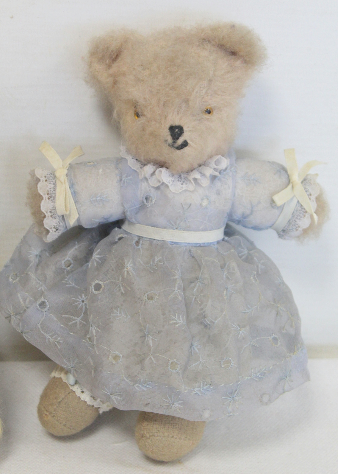 Two early 20th century vintage teddy bears, one miniature in white mohair wearing a blue dress, 19cm - Image 2 of 4