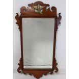 George III style mahogany veneered wall mirror with fret cut frame, pierced bird pediment and
