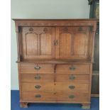 Arthur Simpson of Kendal. Arts & Crafts oak side cupboard with plain pediment and carved frieze