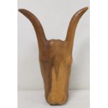 Carved wooden head of an ox, sculpted from a single block of wood, incised with number XVI, 48cm