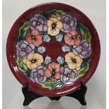 Modern Moorcroft Pottery "Pansy" pattern circular plate, designed by Rachel Bishop, impressed and