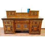 Late Victorian aesthetic period walnut and ebonised sideboard in the manner of Lamb of Manchester,