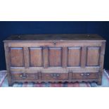 Late 18th/early 19th century walnut dower chest with a hinged top above a panelled front and three