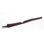 Australian Aboriginal carved wood spear thrower, the tapered stick with incised decoration and