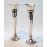 Pair of silver hammered vases, Sheffield 1913, of tapering shape, loaded, 21.5cm.