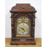 Late 19th century carved oak continental bracket clock by Winterhalder & Hofmeier, retailed by DC