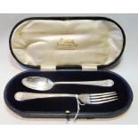 Silver child's spoon and fork, Birmingham 1909, with engraved decoration, cased, 83g or 2½oz.