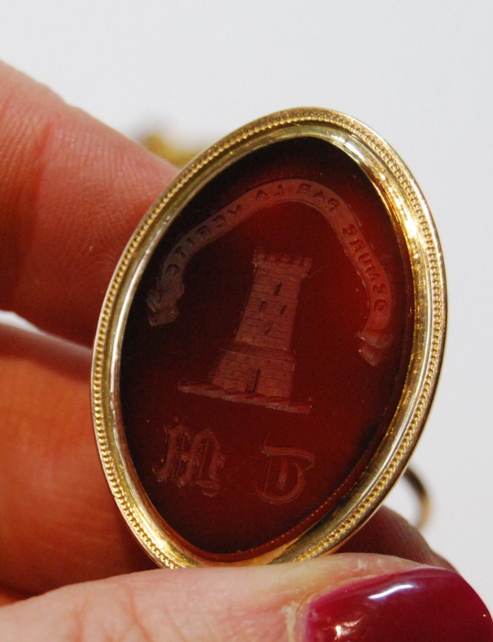 Georgian gold watch fob seal with oval crested and initialled carnelian, c. 1810, and a pair of gilt - Image 2 of 4