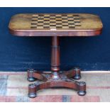 Regency inlaid mahogany games table with an ebony and satinwood chequered games top above a turned