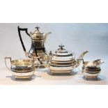 Silver four-piece tea set by Deakin & Son, Sheffield 1933, of ovoid boat shape on ball feet, 58oz or