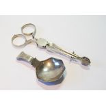 Silver sugar nips, c. 1760, and an engraved caddy spoon, Birmingham 1806.  (2)