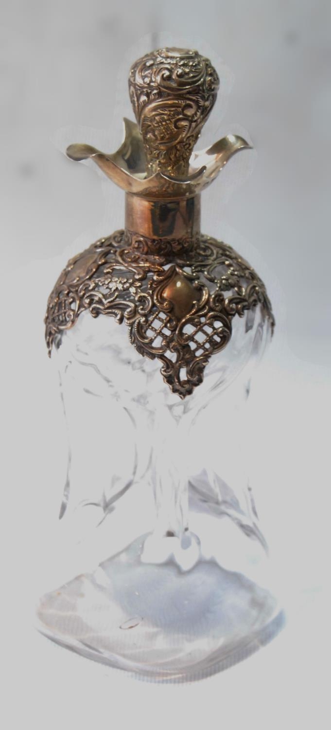 Glass 'glug glug' decanter by Henry Mathews, Birmingham 1897, with pierced and embossed silver