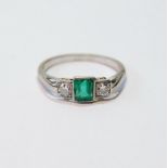 Art Deco diamond and emerald three-stone white gold ring, the rectangular emerald approximately