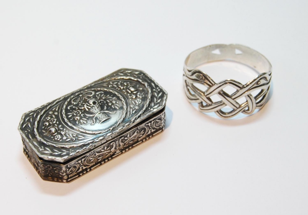 Silver rectangular box with embossed flowers and sprays, also a napkin ring.  (2)