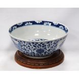 Chinese punch bowl with all over blue and white prunus blossom banding to the interior top above a