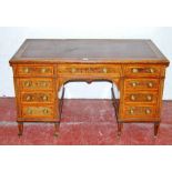 Edwardian inlaid mahogany kneehole desk with a tooled leather skiver above a long drawer flanked
