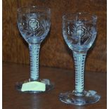 Two George III style wine glasses, the bowls with etched ferns above an air twist stem, on