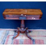 Regency rosewood card table, the fold-over top enclosing a later green baize interior, on a carved