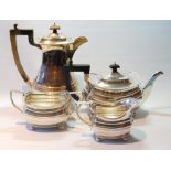 Silver four-piece tea set, Birmingham 1913, of rectangular boat shape, gadrooned edge, on ball feet,