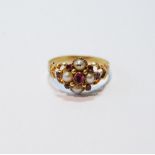 Mid-19th century ruby and pearl ring of openwork form with engraved band, probably 15ct, size O.