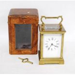 Brass four glass carriage clock with white enamel dial and Roman numerals, 20cm high, with