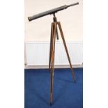 WWI period cylindrical brass and metal telescope, 100cm long, on a wooden tripod stand.