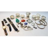 Six silver and other napkin rings, an egg cup, watches and other items.